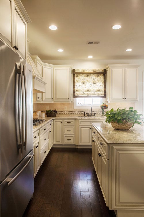 antique white kitchen cabinets with black island